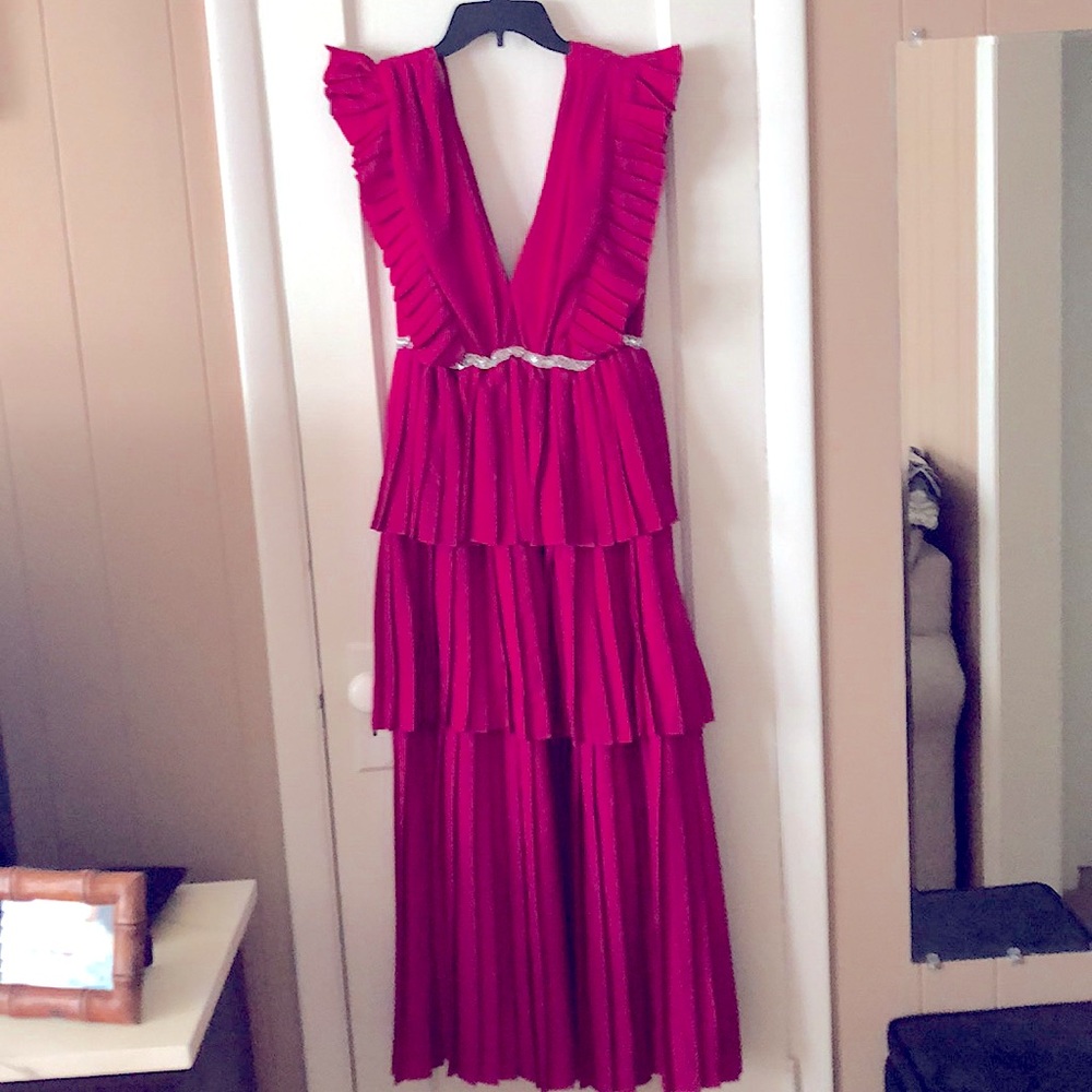 Beautiful magenta dress. It’s 28” from crystal belt to the bottom hem of dress.